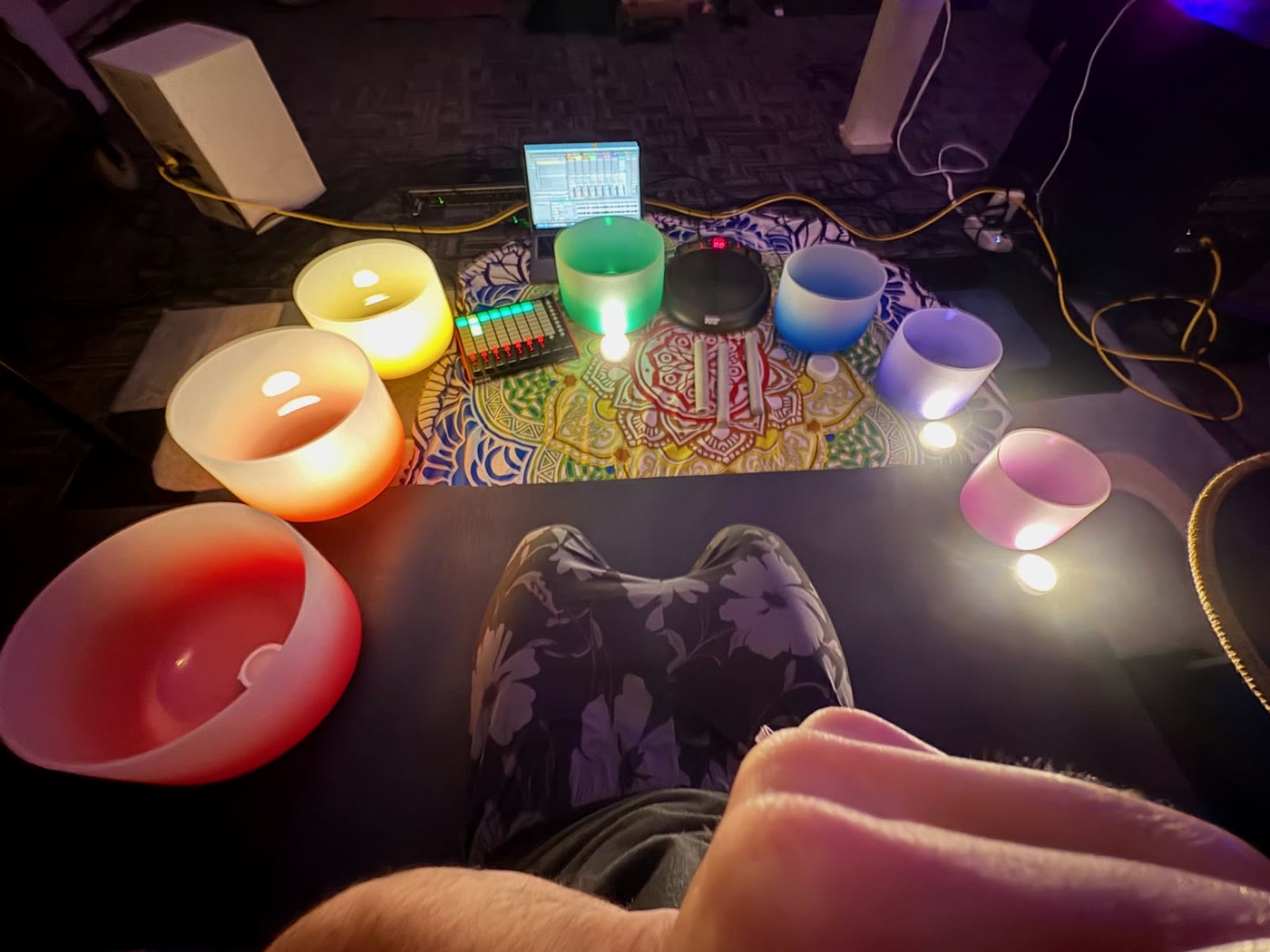 Glowing crystal bowls set out for a session